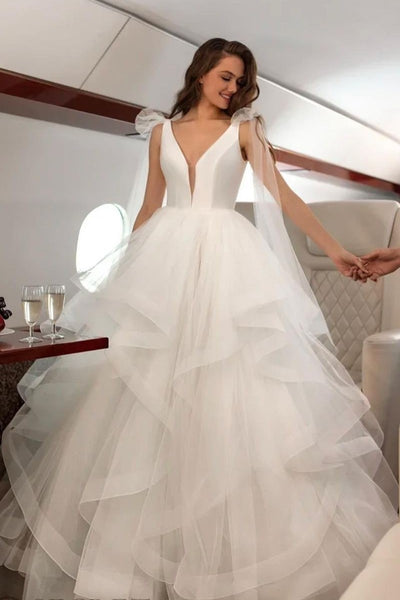 plunging-sleeveless-wedding-gown-with-horsehair-tulle-skirt