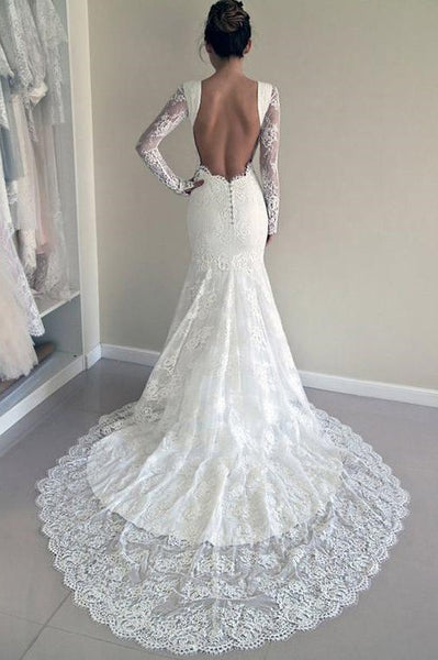 Romantic lace wedding dress with sheer sleeves, traditional bridal
