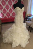 curve-hugging-beaded-wedding-dresses-with-ruffled-textured-skirt-2