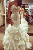 curve-hugging-beaded-wedding-dresses-with-ruffled-textured-skirt