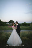 Plunging V-neck A-line Tulle Crystals Bridal Gown
