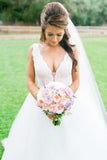 plunging-v-neckline-wedding-dress-with-detachable-overskirt