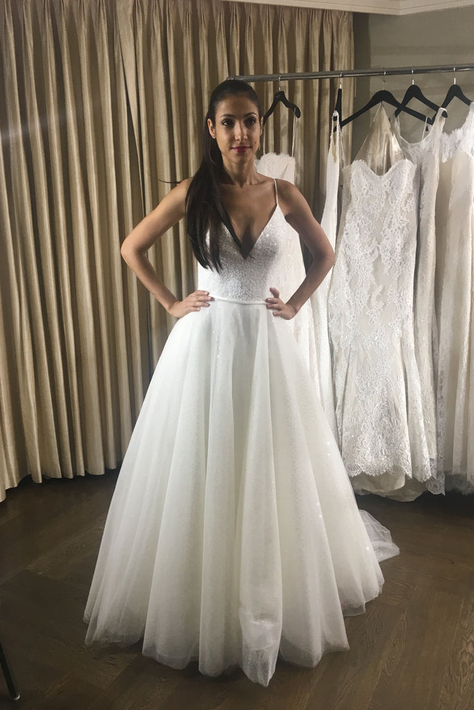 https://www.loveangeldress.com/cdn/shop/products/sequin-tulle-wedding-dresses-crystals-deep-v-neck-spaghetti-straps_1024x1024.jpg?v=1571869763